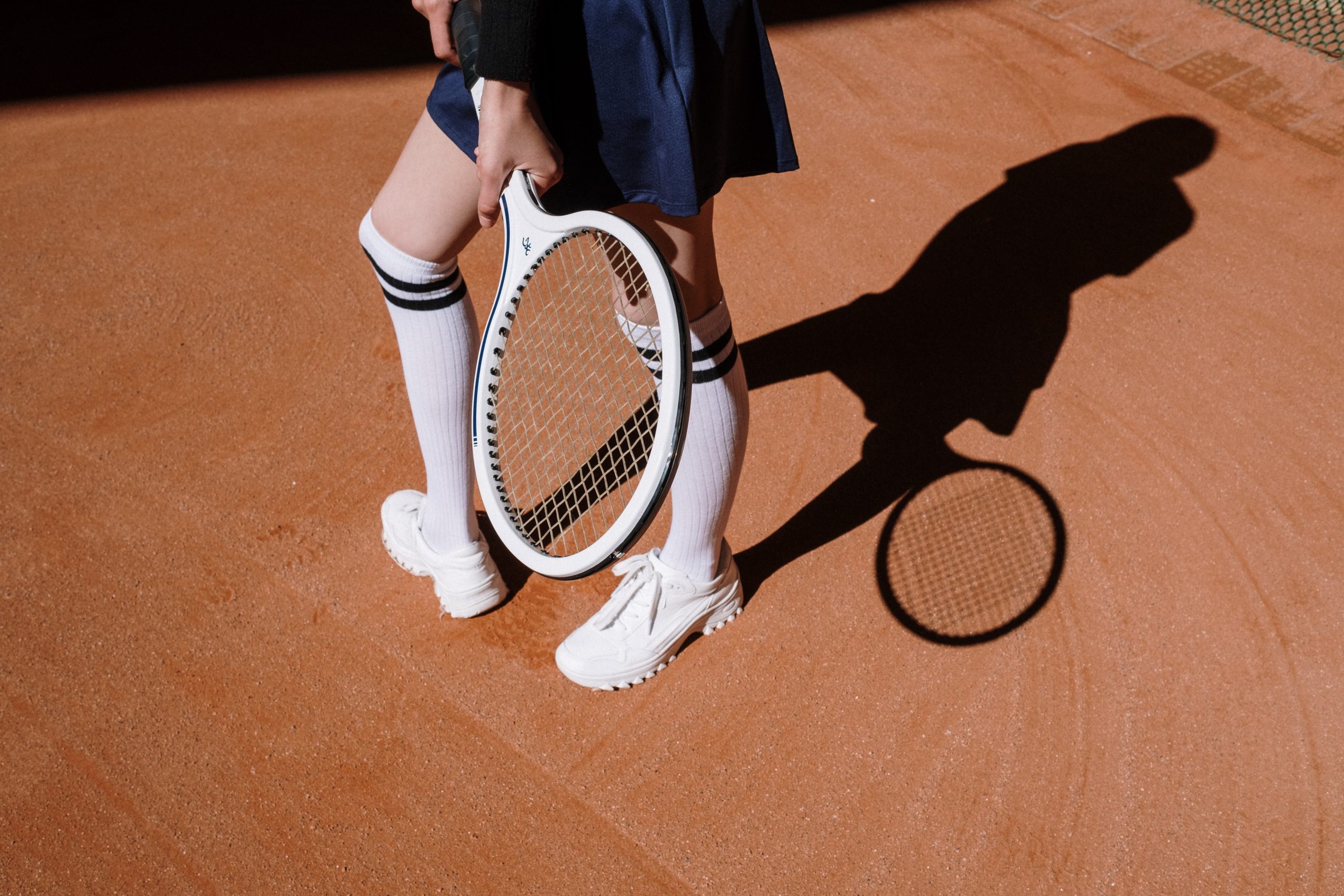 Tennisspielerin Schattenwurf